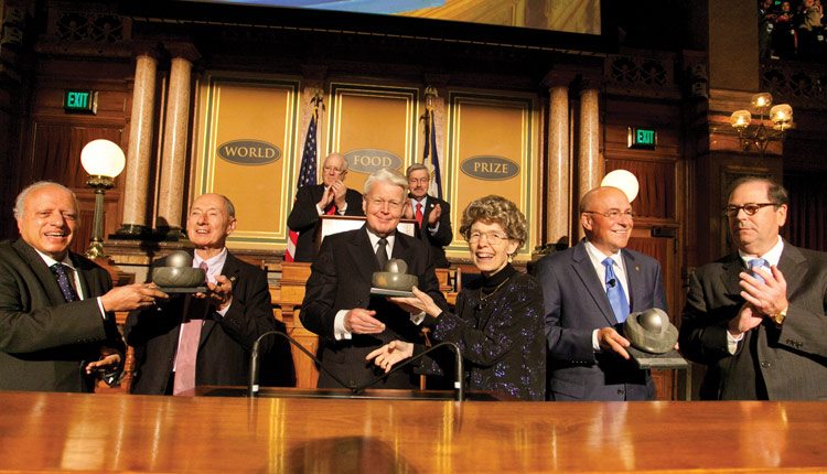 The 2013 World Food Prize was presented in Des Moines, Iowa. Pictured left to right are: M.S. Swaminathan, the first World Food Prize laureate and now chair of the laureate selection committee; 2013 prize winner Marc Van Montagu; Olafur Ragnar Grimsson, president of Iceland; 2013 prize winner Mary-Dell Chilton; 2013 prize winner Robert Fraley; and John Ruan III, chair of the World Food Prize. Photo: World Food Prize.