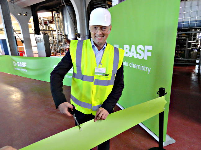 Philipp Rosendorfer, vice-president of research and development for BASF Functional Crop Care, cuts the ribbon at today's inauguration ceremony. Photo by Marc Zienkiewicz