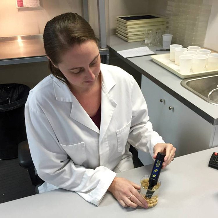 Elyse Ellis of Seed Check Technologies performs an electrical conductivity test to determine the vigour of a seed lot.  Photo: Morgan Webb.