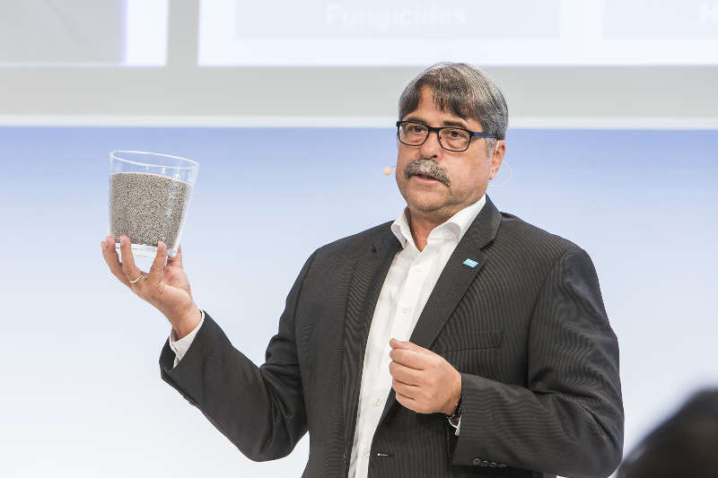 Markus Heldt, president of BASF Crop Protection, holds up a kilogram of the company’s product Nodulator product, a highly efficient active strain of rhizobium, selected to perform on soybean seed. 