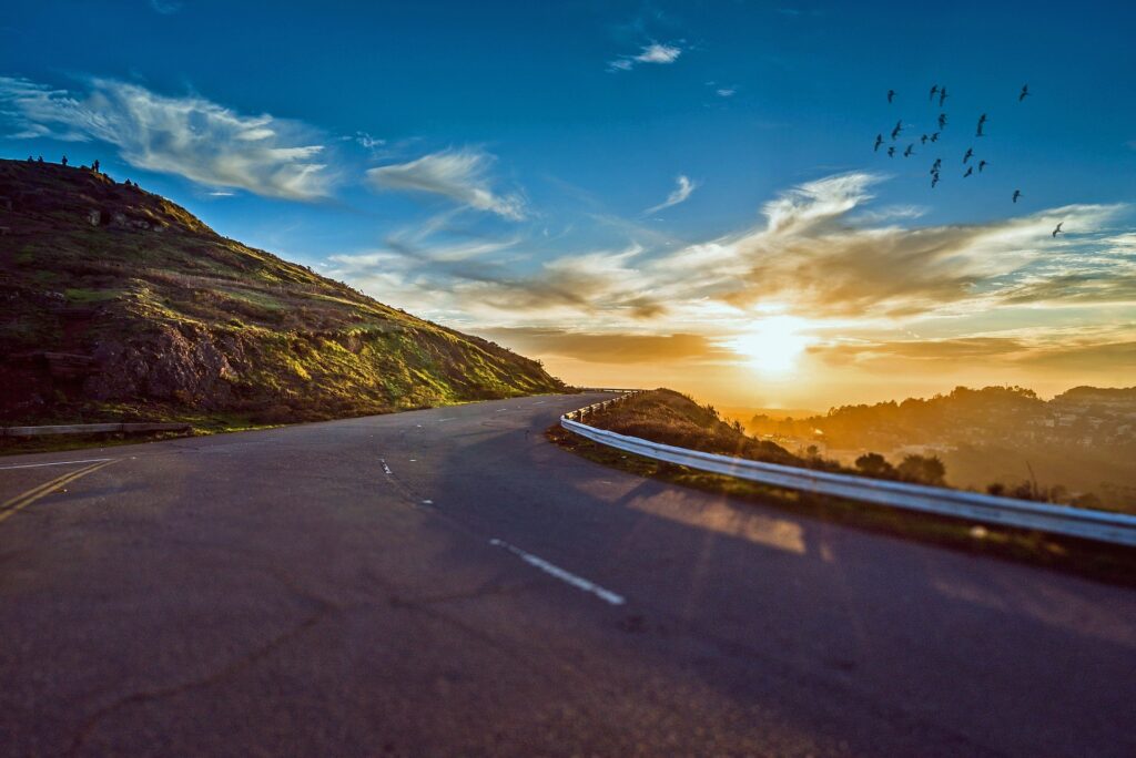 picture of bright sky and winding road