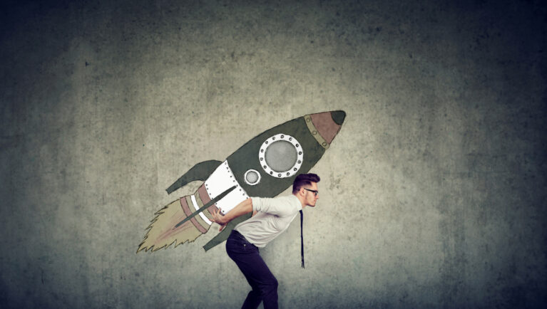 Side view of businessman inspired with fast growth with rocket on background