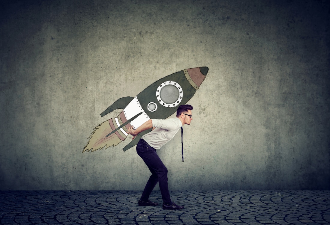 Side view of businessman inspired with fast growth with rocket on background