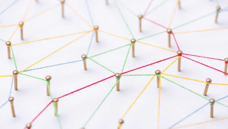 abstract web line connection of color yarn from nail node to node on white background , networking concept