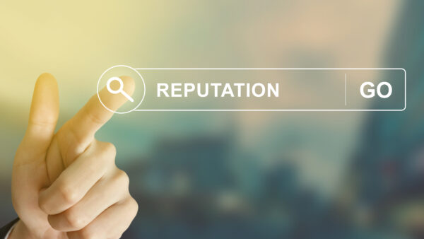 business hand clicking reputation button on search toolbar with vintage style effect