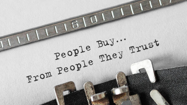 Text People Buy From People They Trust typed on retro typewriter