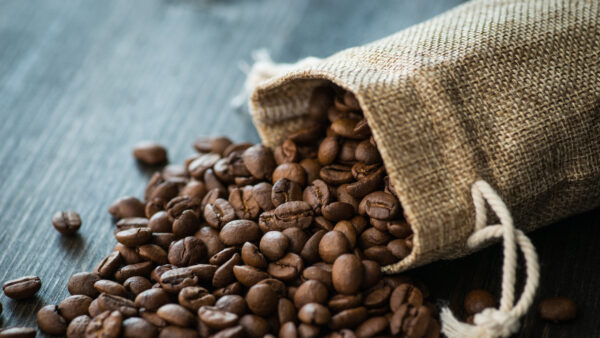 Roasted coffee beans on old wooden table