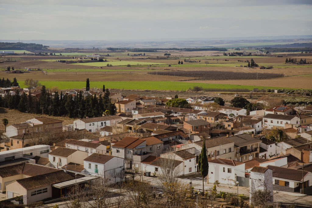 Panoramic view of the Catalan village of Suchs in Lleida, surrounded by farmland and fields