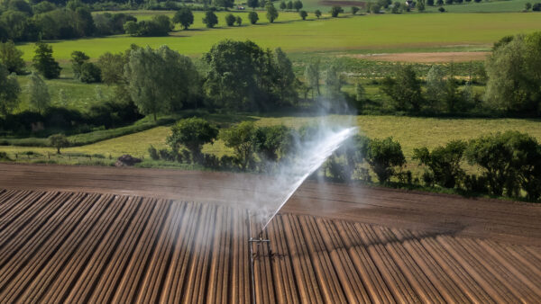 An aerial view of farmland being irrigated near Bures in Suffolk, UK
