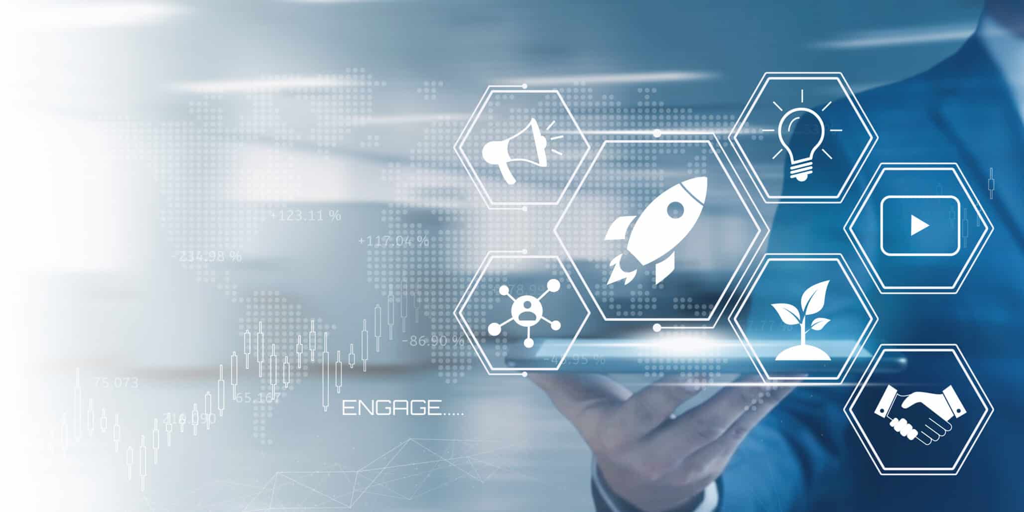 Businessman holding a tablet displaying a futuristic interface with startup and marketing icons representing digital innovation and growth strategies