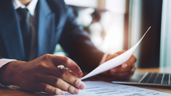 hr audit resume applicant paper and interview with using pen and computer laptop for selection human resource to company.