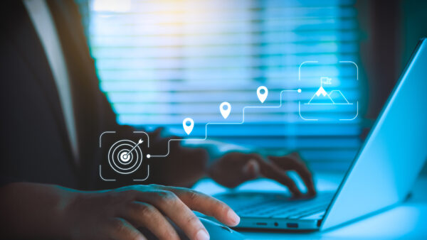 Business Goal Setting, Strategic Planning Concept, Professional Using Laptop and Mouse, Digital Roadmap Icons Showing Target, Milestones, Growth Path, and Achievement for Corporate Strategy Success