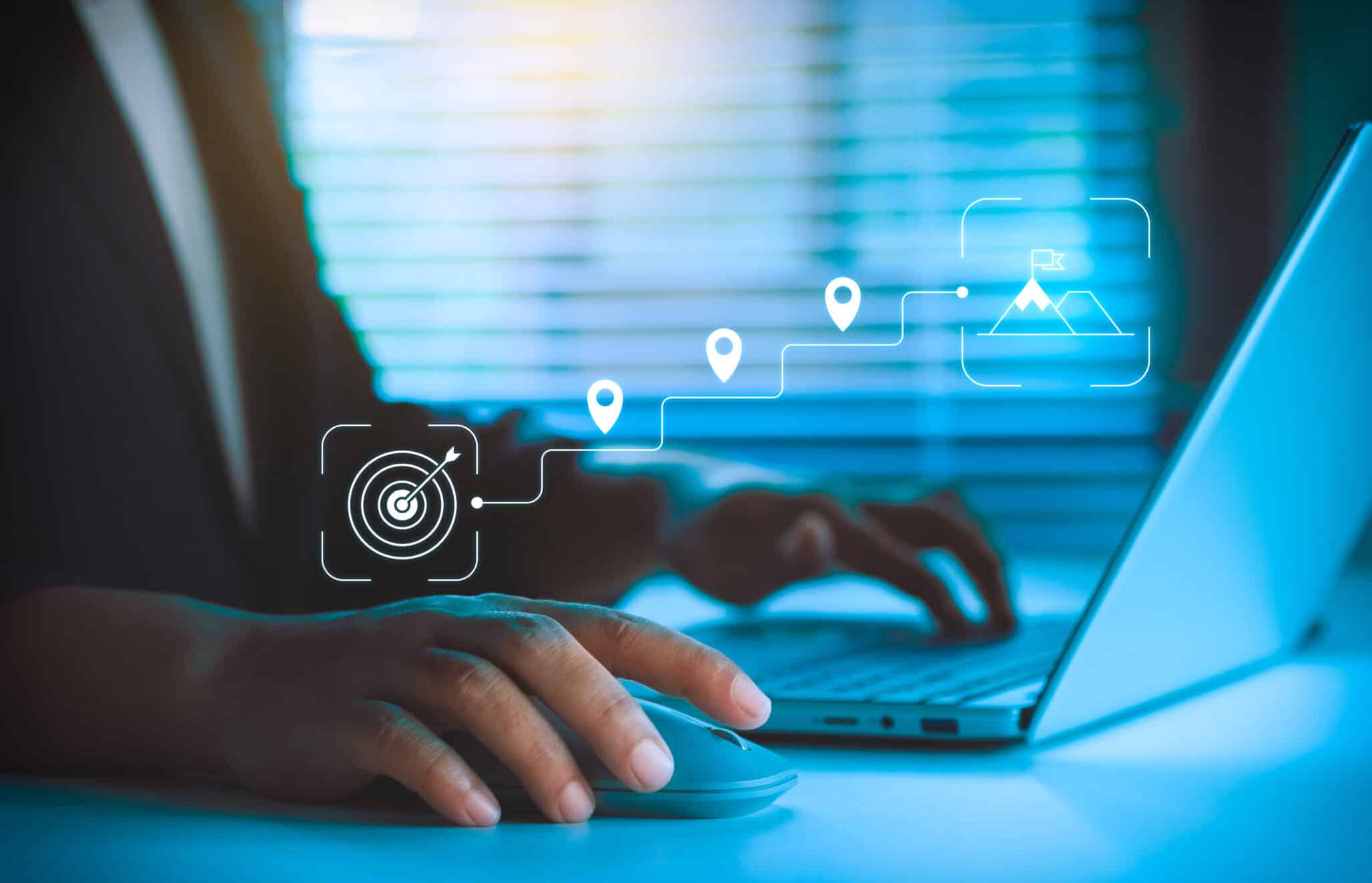 Business Goal Setting, Strategic Planning Concept, Professional Using Laptop and Mouse, Digital Roadmap Icons Showing Target, Milestones, Growth Path, and Achievement for Corporate Strategy Success
