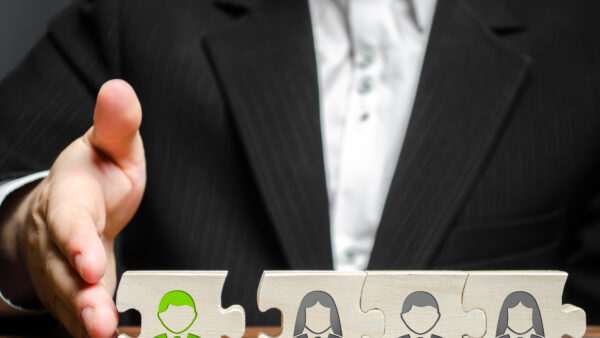 A businessman joins a new employee to the team as its leader. Hiring new employees for the project., teamwork. leader works with the team as a member. increasing efficiency, confidence, communication