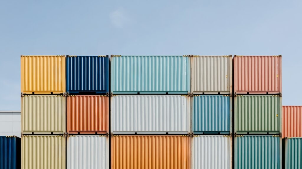 Colorful shipping containers illustrate global trade as the seed industry urges elimination of tariffs on planting seed.