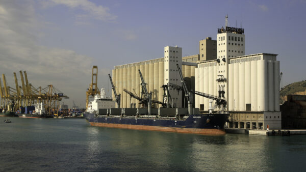 Barcelona, Spain-October 14, 2010: A ship unloading grain into a grain elevator, Bacelon, Spain.