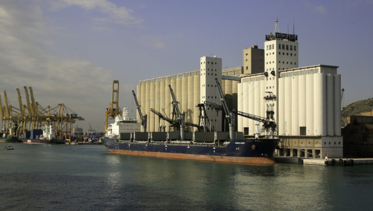 Barcelona, Spain-October 14, 2010: A ship unloading grain into a grain elevator, Bacelon, Spain.