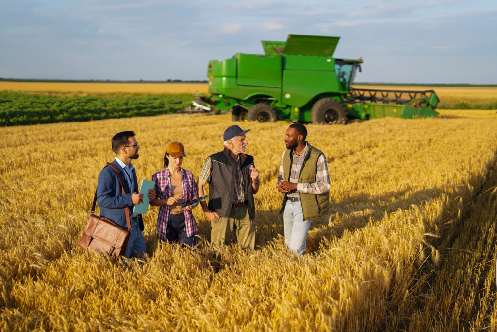 Agricultural stakeholders collaborating on sustainable farming, investment and rural development initiatives.