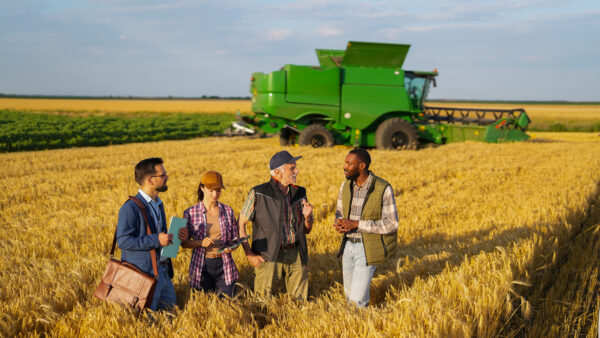 Agricultural stakeholders collaborating on sustainable farming, investment and rural development initiatives.